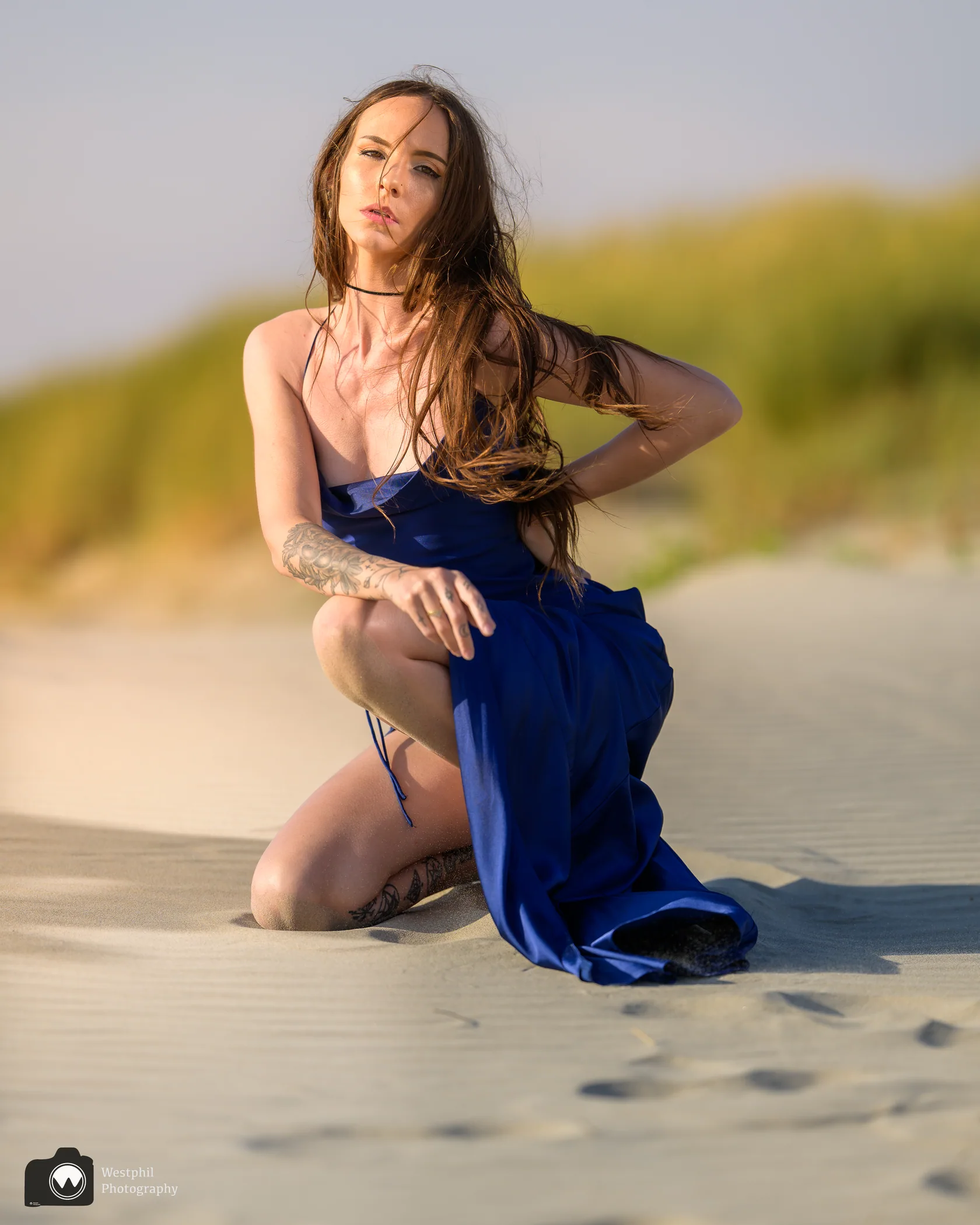 Caitlyn McEwen in a blue dress in a natural outdoor portrait